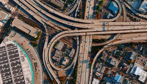 Highways, loops and freeways with multiple transport moving by downtown of Los Angeles
