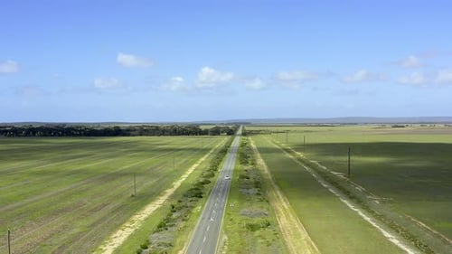 4k drone footage of a car driving along a country road