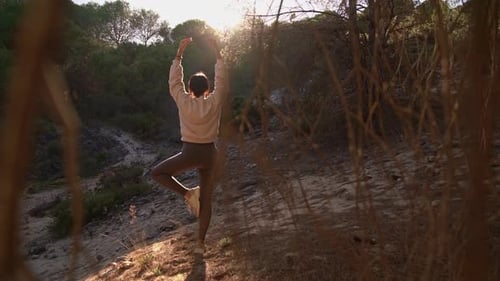 Girl Doing Yoga in the Forest