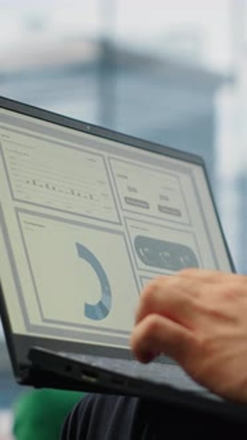 Vertical Video General Director Reviewing Infographics and Monthly Reports
