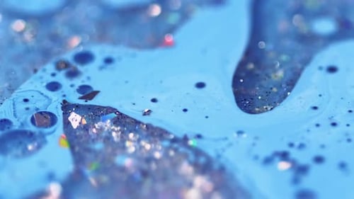 Sparkling Blue Liquid with Glitter Close Up