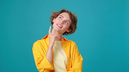 Woman Thinks Against a Blue Background