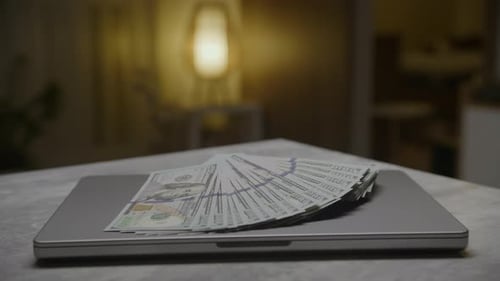 Laptop with One Hundred Dollar Bills