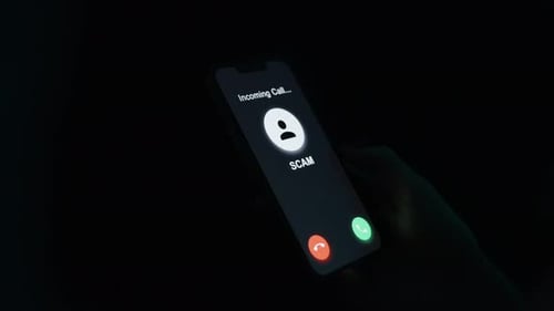 Dark Incoming Scam Call on Smartphone in Hand