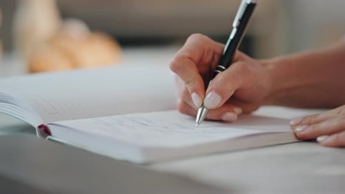 Hand Writes In Notebook, Uses Laptop