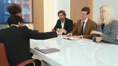 Business Professionals Meeting in Bright Modern Conference Room
