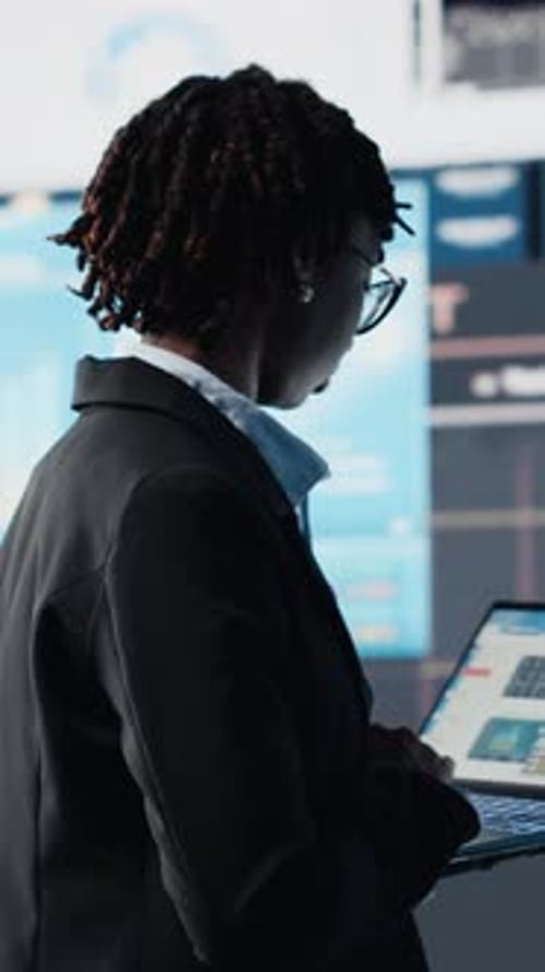 Vertical Video Manager Using Laptop Software to Compare Company Metrics