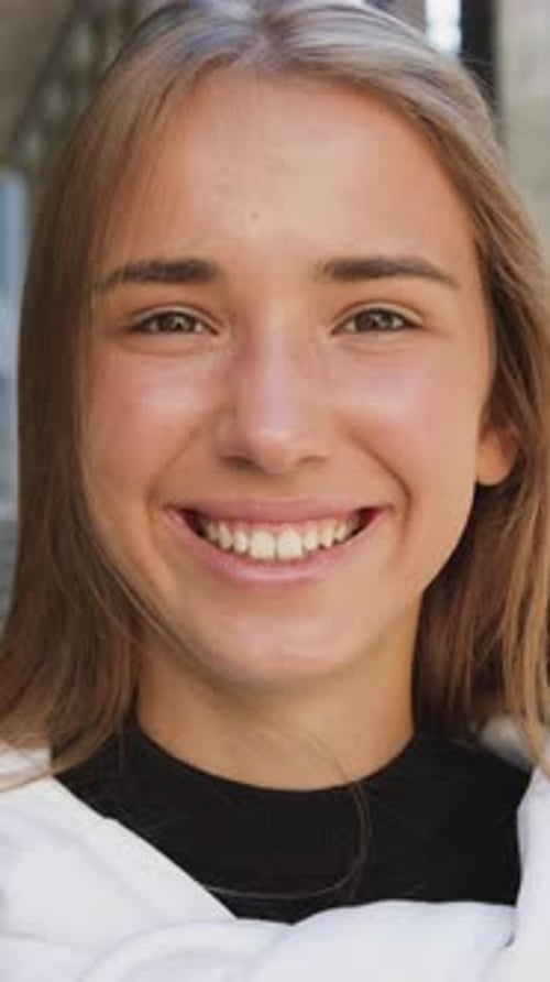 Smiling Young Woman Portrait in Vertical Close Up