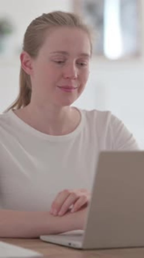 Beautiful Young Woman Talking on Video Call on Laptop in Office, Vertical Video