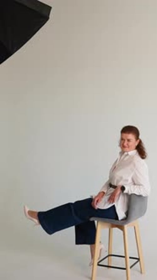 Confident Middle Aged Businesswoman Posing in Photo Studio