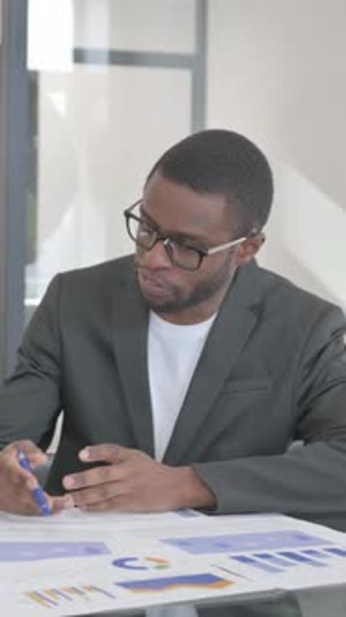 Multiethnic Teammates Doing Paperwork in Office, vertical video