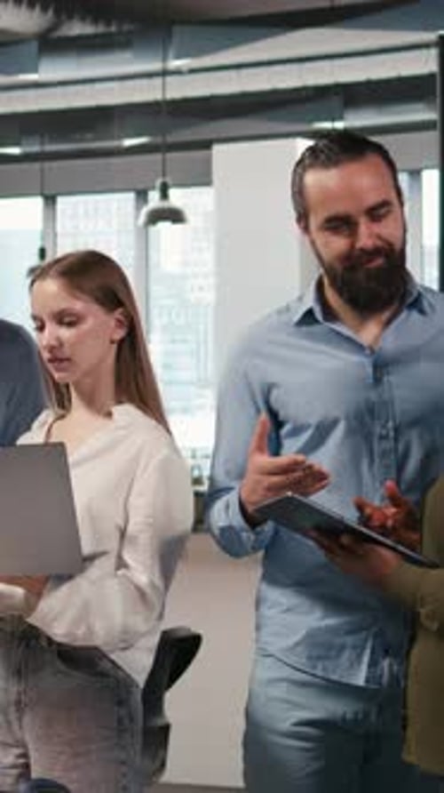 Vertical Video Team of Programmers in Office Automating Repetitive Tasks Using AI Scripts