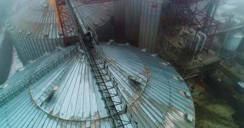 Grain modern elevator containers. Huge elevator steel storage aerial view.
