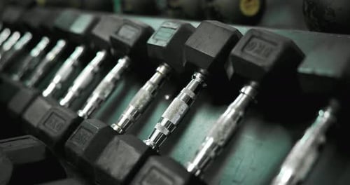 Equipment, metal and dumbbell in gym for sports, weightlifting and strength training for power