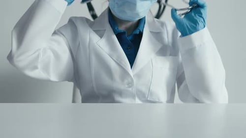 Professional Health Care a Doctor in a Medical Gown Ready to Provide Medical Care in a Clinic or