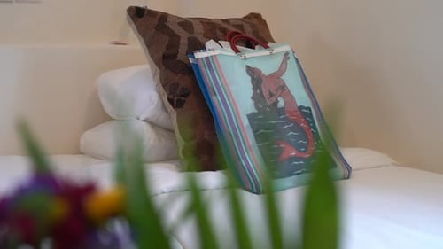 Comfortable bed with pillows at a spa, hotel, retreat, cruise, bed and breakfast or guest room - sli