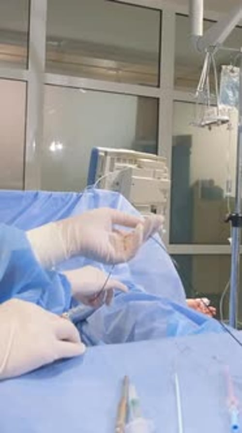 Medical Professional Performing Surgical Procedure