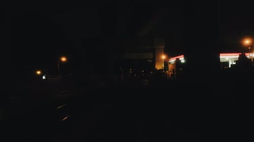 Time lapse of night traffic with motion blur in city. 4K.