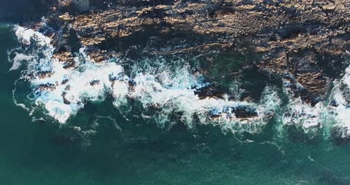 Waves crashing on rocks