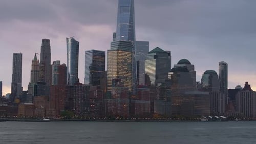 Seagull Gliding Above Illuminated Lower Manhattan Skyline Featuring One World Trade Center and
