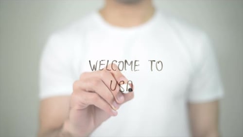 Welcome to USA, Man Writing on Transparent Screen