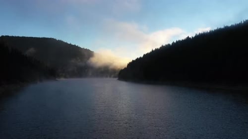 Aerial Drone View of a Lake in Misty Dawn Lights in Early Morning