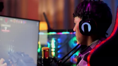 Young Adult Playing Video Games and Celebrating