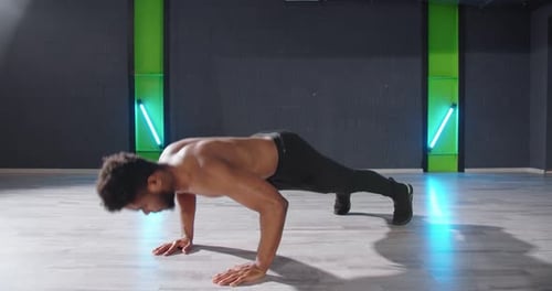 Full Length View of the Gorgeous Multiracial Man Warming Up and Doing Some Push Ups Carefully While