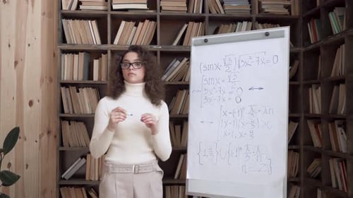 Confident Hispanic Young Woman Teacher Stand Point at Whiteboard Giving Class Teaching