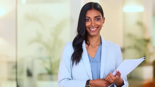 Happy, confident and successful businesswoman holding files while doing admin in an office