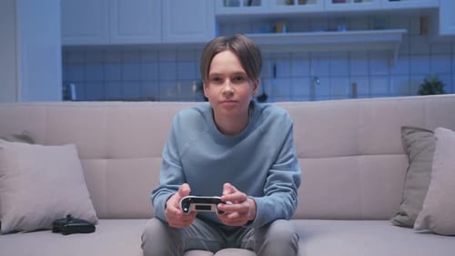 Teenager Playing Video Games at Night