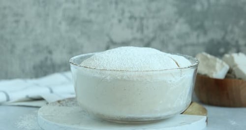 Dough Rises in Glass Bowl Before Baking