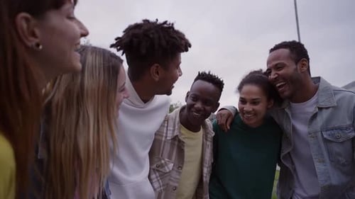 Cheerful Young Group Multiethnic Friends Hugging Enjoying Spring Day Outdoors Laughing Students