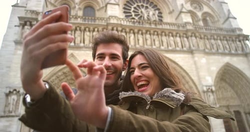 Happy Young Couple Take Selfie at City Landmark