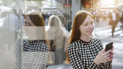 City Lifestye Portrait of Attractive Confident Woman Browing on Smart Phone