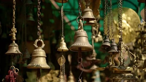 Prayer Bells For Sale in a Nepal Market, Gold Metal Prayer Bells in a Shop at a Temple at Bhaktapur