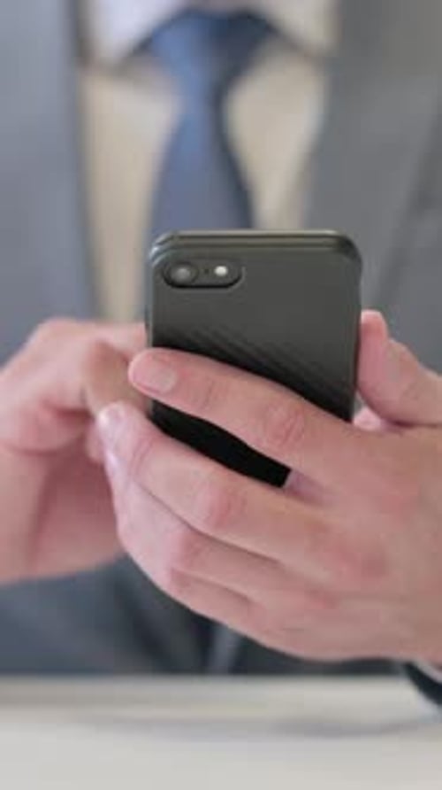Vertical Video of Close up of Businessman using Smartphone, Mobile