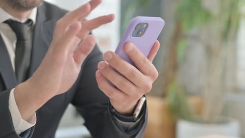 Close up of Businessman Hand Using Smartphone
