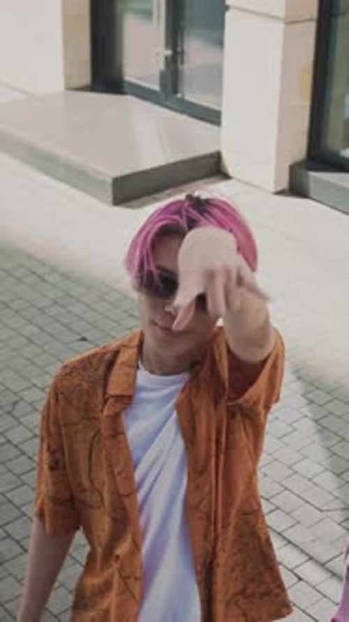 Stylish Person Dancing on City Sidewalk