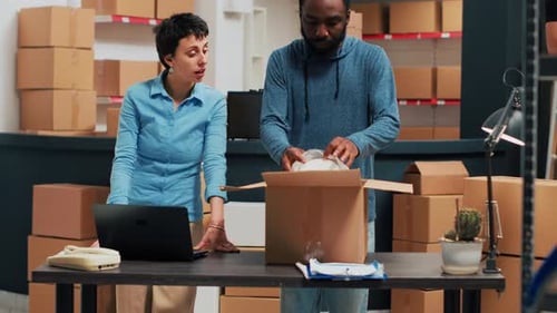 Warehouse Team Packing Boxes for Shipping Orders