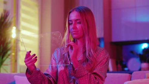 Shooting of Young Nice Woman Using Glass Digital Tablet View of Girl Wears Pajama Holding Device in