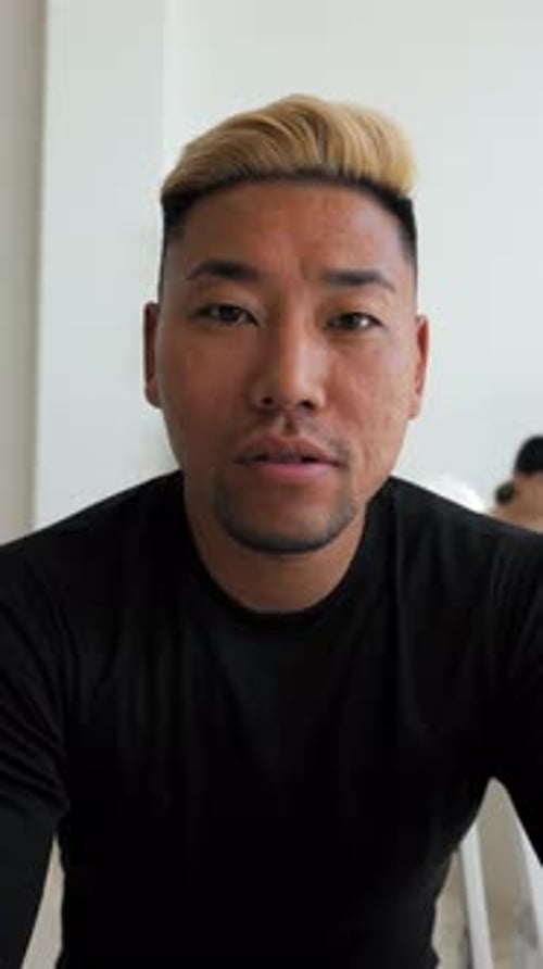 Young adult talking to camera in close up