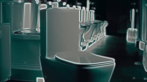 Modern Toilets on Display in Dark Showroom