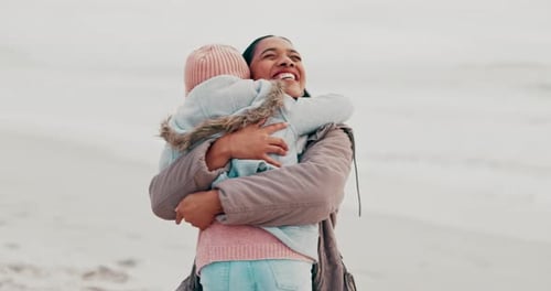 Girl, hug and mother with happiness at ocean with care on holiday for bonding in outdoor