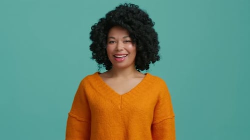 Woman Smiles and Winks at Camera