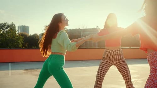 Women in Retro Clothes Spinning on Four Wheel Roller Skates