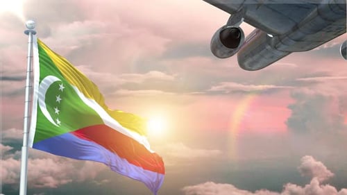 Die Flagge der Komoren weht realistisch, das Himmelsflugzeug hebt bei Sonnenaufgang