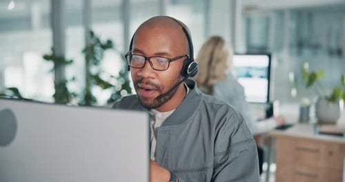 Customer service, office and black man on computer with headset for talking