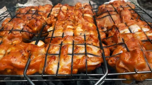 Barbecue Meat is Fried on Charcoal on the Grill in Smoke Closeup