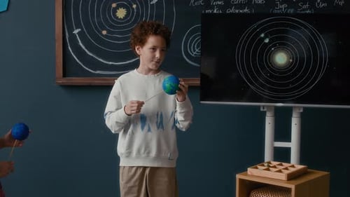 Children Learning About Solar System in Classroom